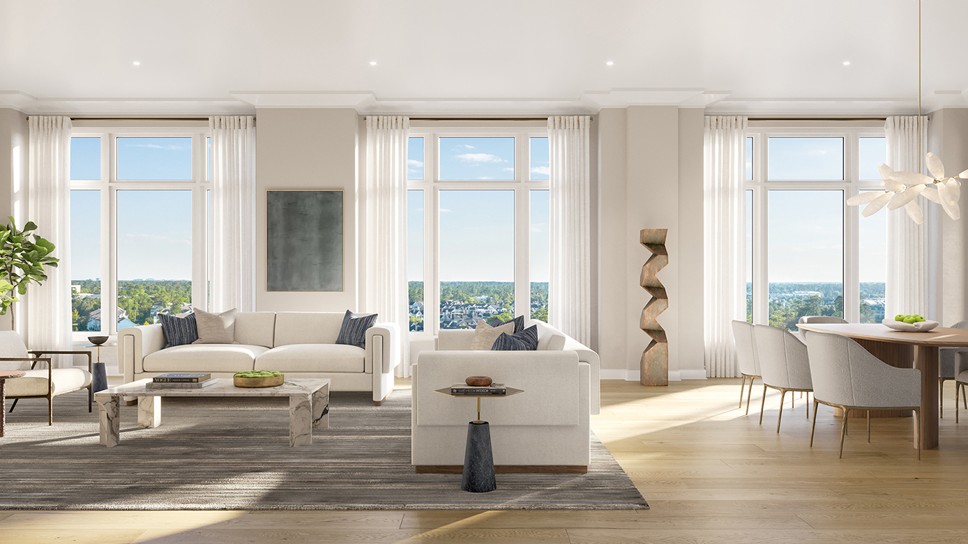 Living room view with a partial view of a dining area and white furniture